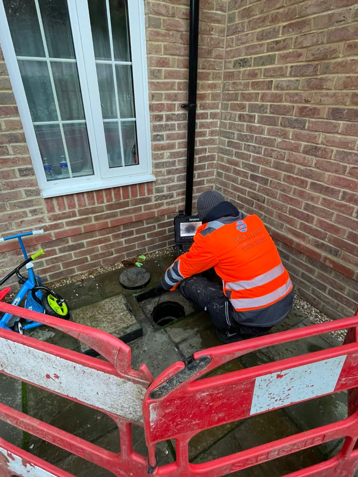 CCTV drainage inspection in progress at a residential manhole